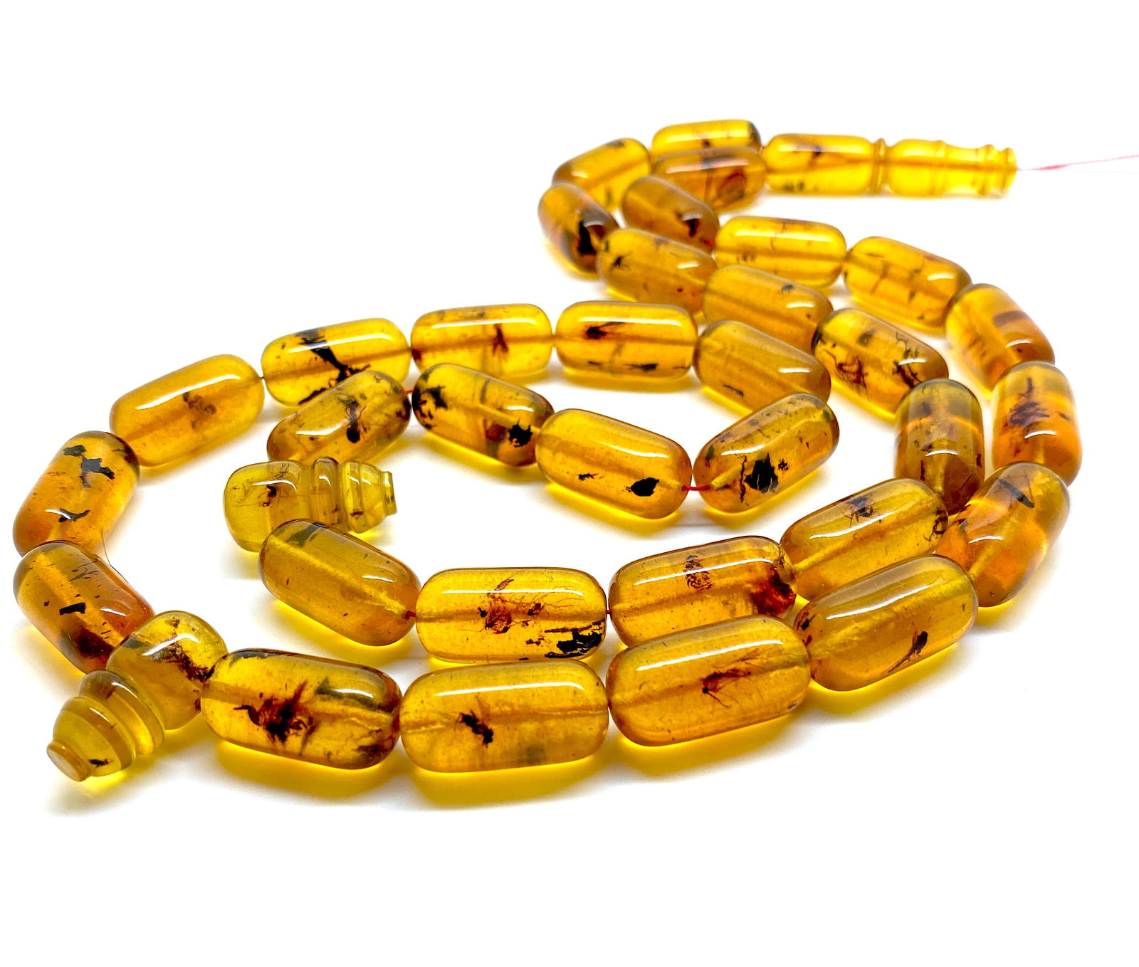 Vintage Amber Tesbih made from Barrel beads with inclusions: Title:Vintage Amber Tesbih made from Barrel beads with inclusionsMetal:NoneGemstone:AmberWeight:53.7 gSize:Bead size: 20.0 x 10.0 mm Bead size: 0.787 x 0.394 inches Made of:(Reconstituted Amber or