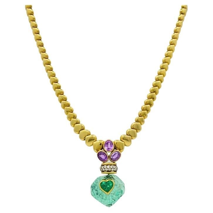André Vassort 18k Gold Colombian Emerald Heart Necklace Sapphire Diamond GIA: Title: André Vassort 18k Gold Colombian Emerald Heart Necklace Sapphire Diamond GIA Description: About the Item This French 18k yellow gold necklace by André Vassort features a carved