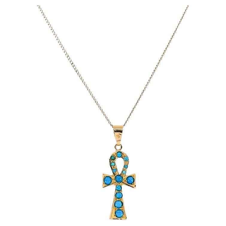 Vintage 21k Gold Turquoise Ankh Pendant 14k Gold Chain Necklace: Title: Vintage 21k Gold Turquoise Ankh Pendant 14k Gold Chain Necklace Description: About the Item This vintage necklace features a 21k gold ankh pendant set with turquoise cabochons, suspended from