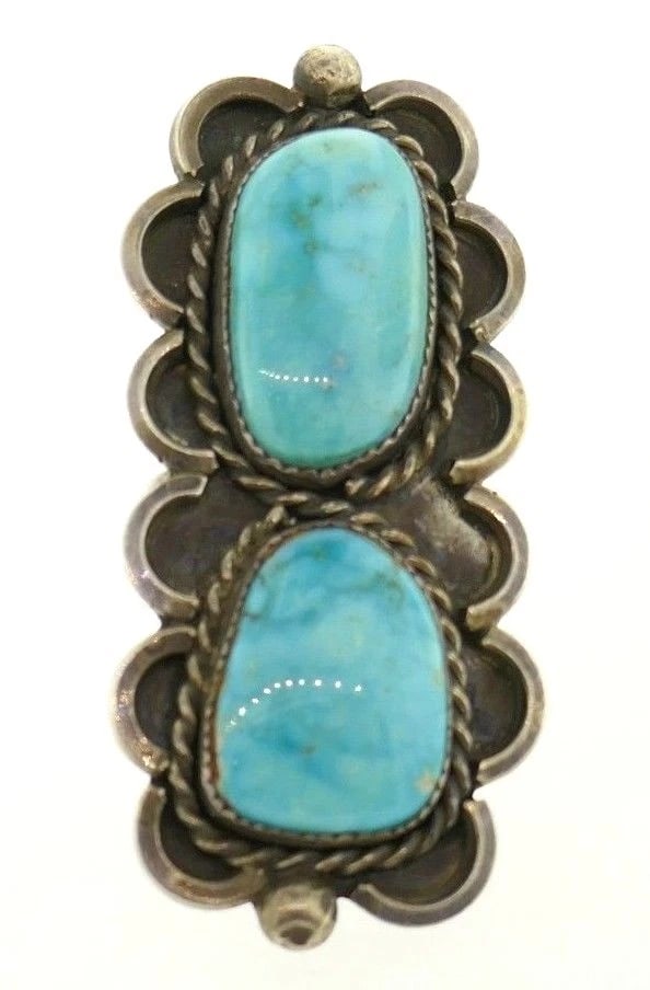 Rectangular Sterling Silver Turquoise Ring: Title: Rectangular Sterling Silver Turquoise Ring Description: Sterling silver ring features two rectangular turquoise stones Measurements: 2 3/8" L x 1" W Weight is 19.9 grams The ring size is 8.25 I