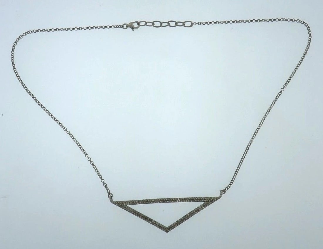 Sterling Silver Diamond Pendant Necklace: Title: Sterling Silver Diamond Pendant Necklace Description: Sterling silver chain necklace with a triangular diamond pendant Stamped with a hallmark for sterling silver (925) Measurements: chain