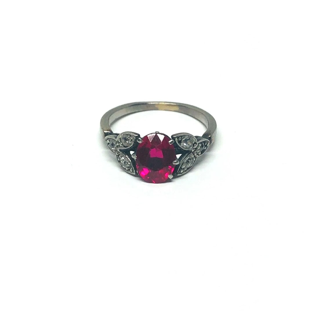 1950’s Platinum Synthetic Ruby Rose Cut Diamond Ring Flower Leaves: Title: 1950’s Platinum Synthetic Ruby Rose Cut Diamond Ring Flower Leaves Description: 1950’s Platinum Ruby Rose Cut Diamond Ring Material: Platinum Gemstone: Synthetic Ruby, Oval