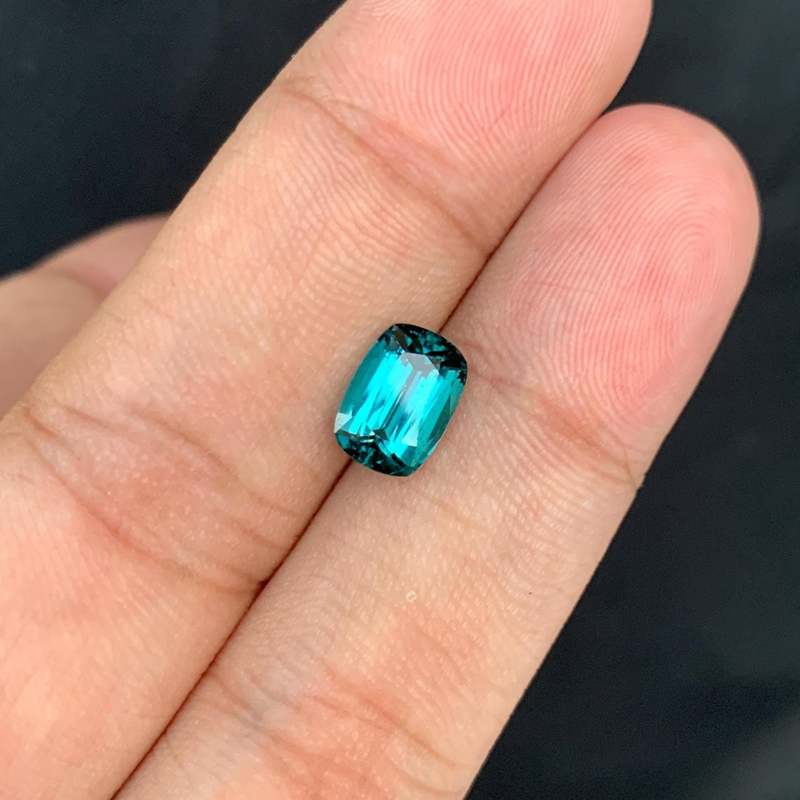 Indicolite Tourmaline Gemstone: 2.50 Ct Cushion Cut, Afghanistan: Materials: Gemstone: Tourmaline Carat weight: 2.50 About this item Weight : 2.50 Carats. Dimension : 9.3*6.5*5 mm Shape : Cushion Cut Clarity : Clean Color : Ink Blue Treatment : None Origin : Afghani