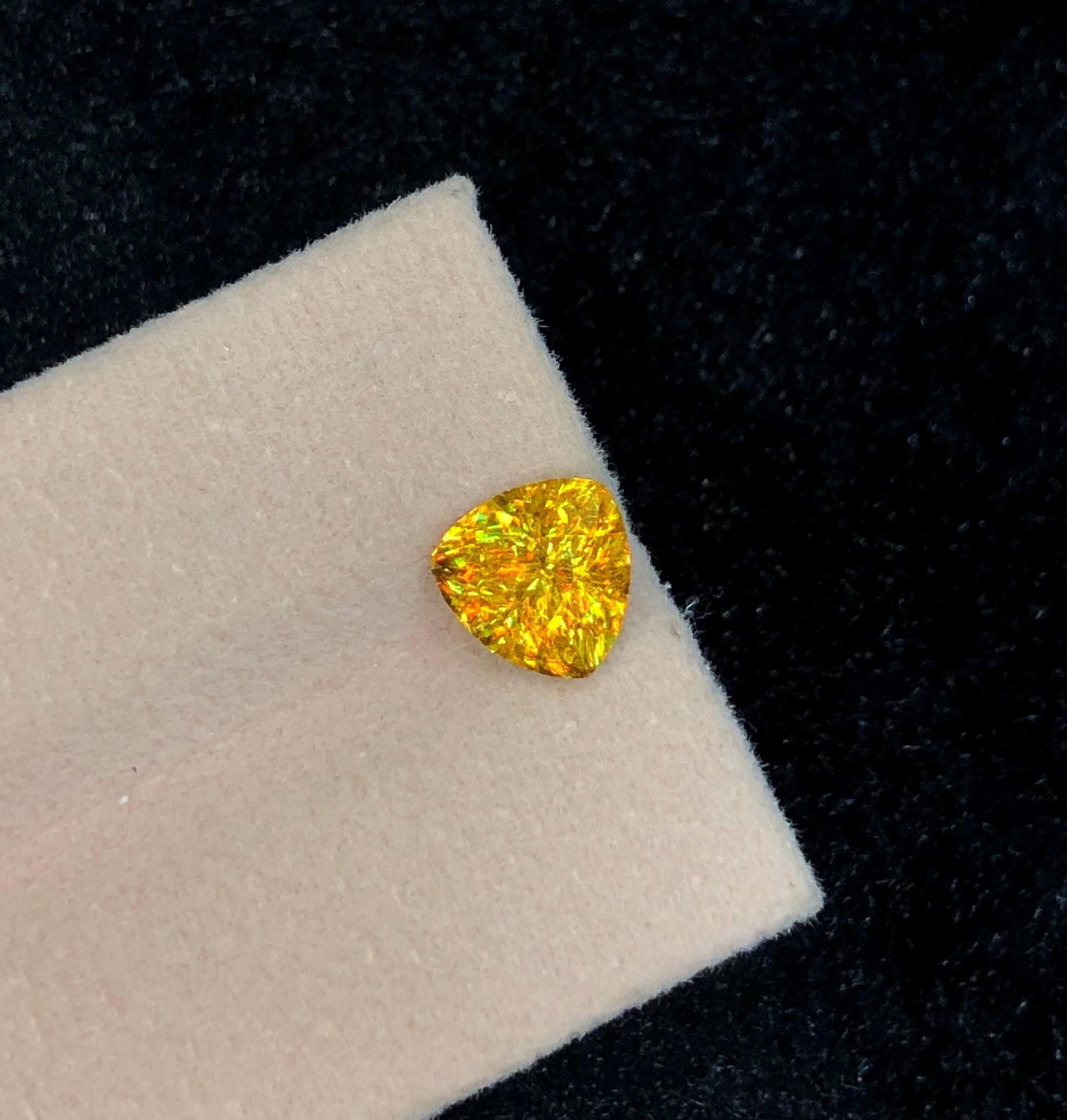 Trillion Cut Sphene Titanite Gemstone: Yellow Orange Sparkle, 2.245 Ct: Materials: Gemstone: Sphene Carat weight: 2.245 About this item This stunning full fire sphene titanite loose gemstone features a captivating Trillion cut that enhances its brilliance and beauty. With