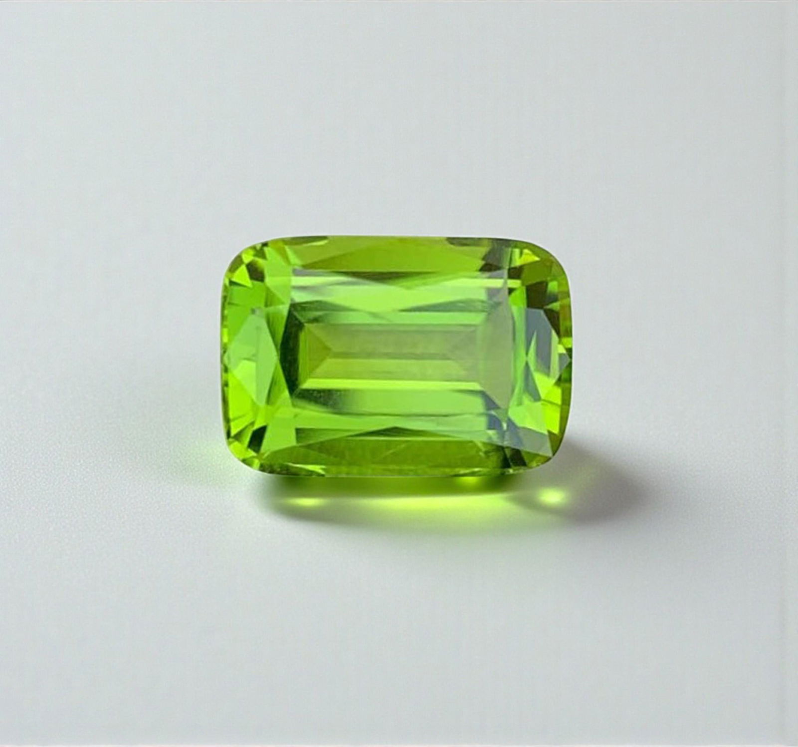 Cushion Cut Peridot Gemstone: Natural August Birthstone (4.68 carats): Materials: Gemstone: Peridot Carat weight: 4.68 Natural Peridot Gemstones, Cushion Cut Peridot Loose Gemstone From Pakistan, August Birthstone weight : 4.68 carat Dimensions :10.5*8*6 mm Shape : Cushi