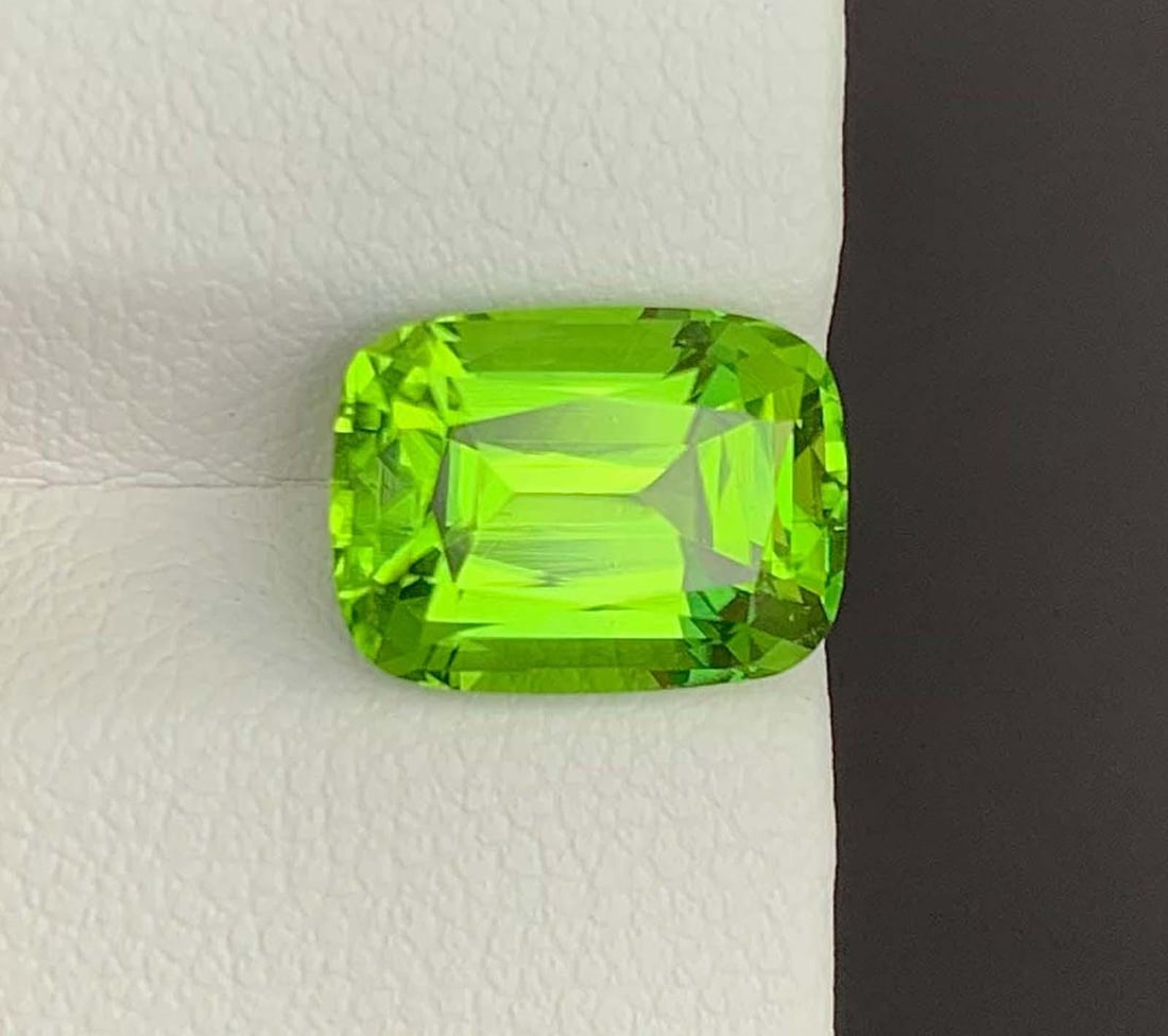Cushion Cut Peridot Gemstone: Natural August Birthstone, Pakistan (4.43 carats): Materials: Gemstone: Peridot Natural Peridot Gemstones, Cushion Cut Peridot Loose Gemstone From Pakistan, August Birthstone weight : 4.43 carat Dimensions : 10.000 * 8.000 * 6.000 MM Shape : Cushion C