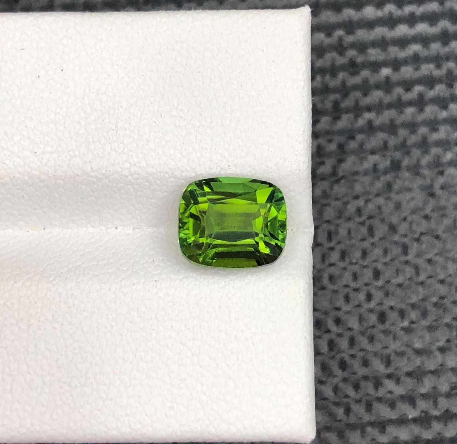 Afghan Forest Green Tourmaline Gemstone: Cushion Cut, 2.29 CT: Materials: Gemstone: Tourmaline Carat weight: 2 Weight : 2.29 CT Dimensions : 8.10 X 6.8 X 5.3 MM Shape : Cushion Clarity : Loupe Clean Color : Forest Green Treatment : None Origin : Afghanistan Hardn
