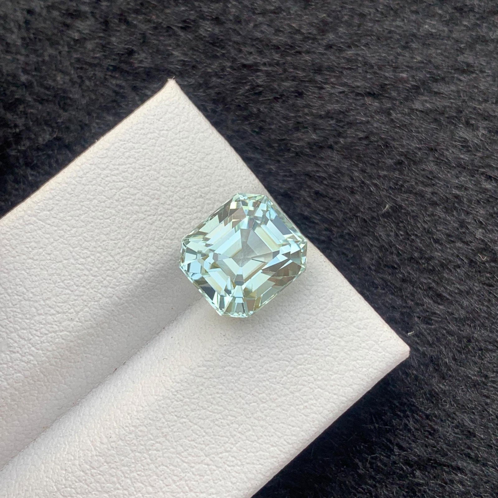 Seafoam Tourmaline Gemstone: 4.70 Carat, Loupe Clean Asscher Cut: Materials: Gemstone: Tourmaline Carat weight: 4.70 Weight : 4.70 carat Dimensions : 9.8*9*7.3 MM Shape : Asscher ( Long ) Clarity : Loupe Clean Color : Seafoam Treatment : None Origin :
