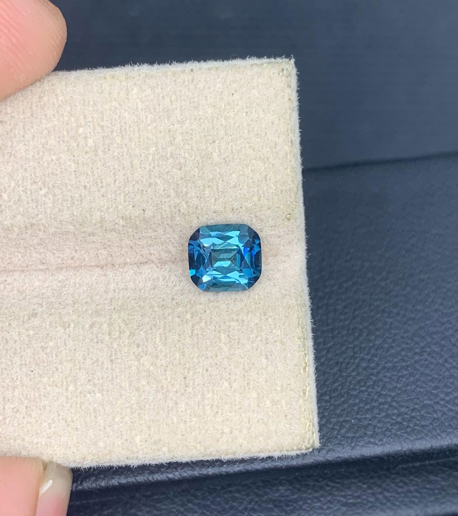 Ink Blue Tourmaline Gemstone: 0.935 Carat Faceted Cushion Cut: Materials: Gemstone: Tourmaline Carat weight: 1 Weight : 0.935 Carat Dimension : 6*5.5*3.5 mm Shape : Cushion Cut Clarity : VVS Color : Ink Blue Treatment : None Origin : Afghanistan Hardness :