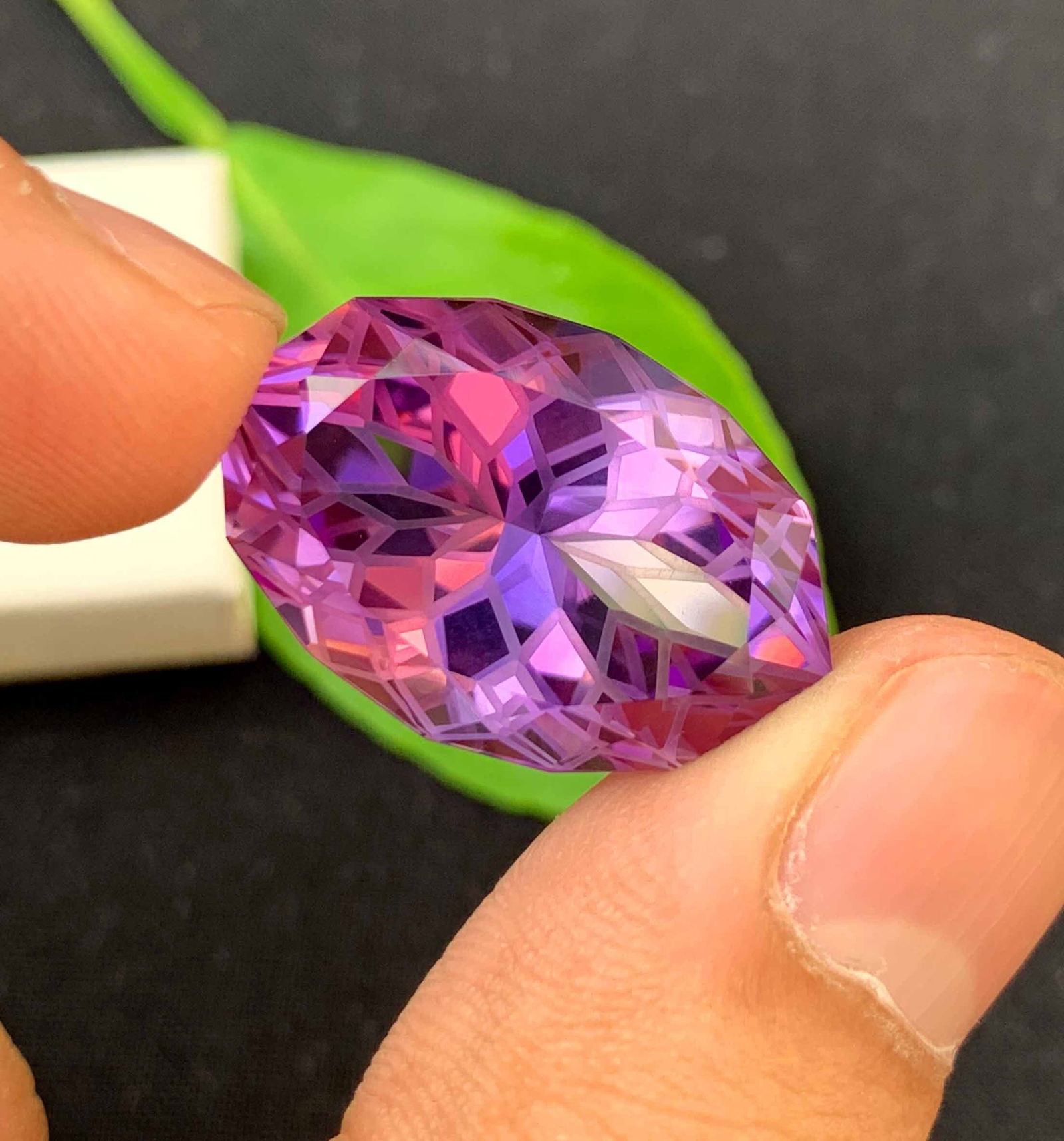 Natural Amethyst Gemstone: Flower Fish Eye Cut, February Birthstone (27.20 Carats): Materials: Gemstone: Amethyst Carat weight: 27.20 Natural Amethyst Gemstone, Flower Fish Eye Cut Amethyst Loose Gemstone February Birthstone weight - 27.20 Carats Dimension - 25.5*17*13 mm Shape : Fan