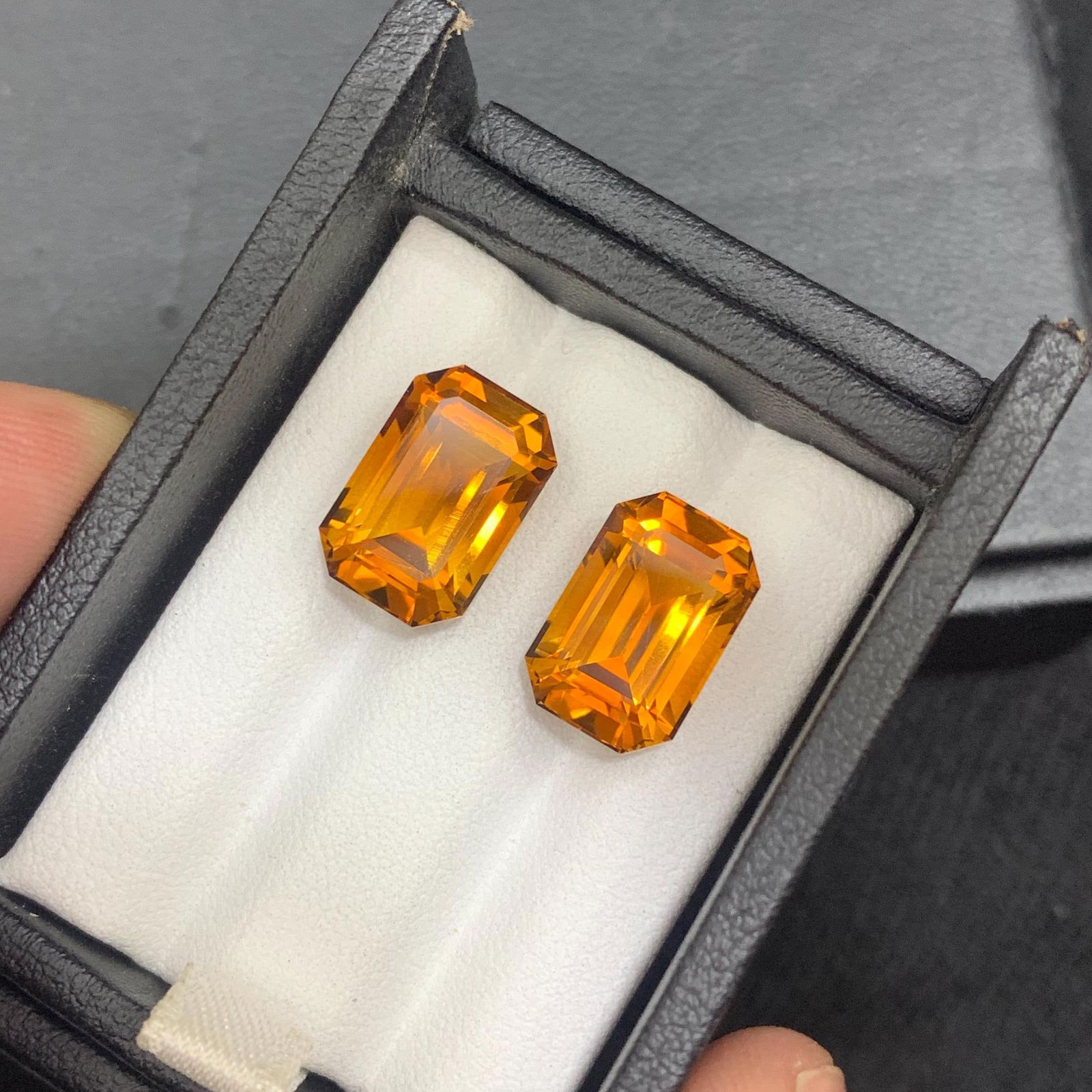 Emerald Cut Citrine Gemstone Pair: Brownish Orange, 12.55 Carat: Materials: Gemstone: Citrine Carat weight: 12.55 About this item Metaphysical Properties: - Known as the success stone, citrine is believed to promote abundance, prosperity, and good fortune - Said