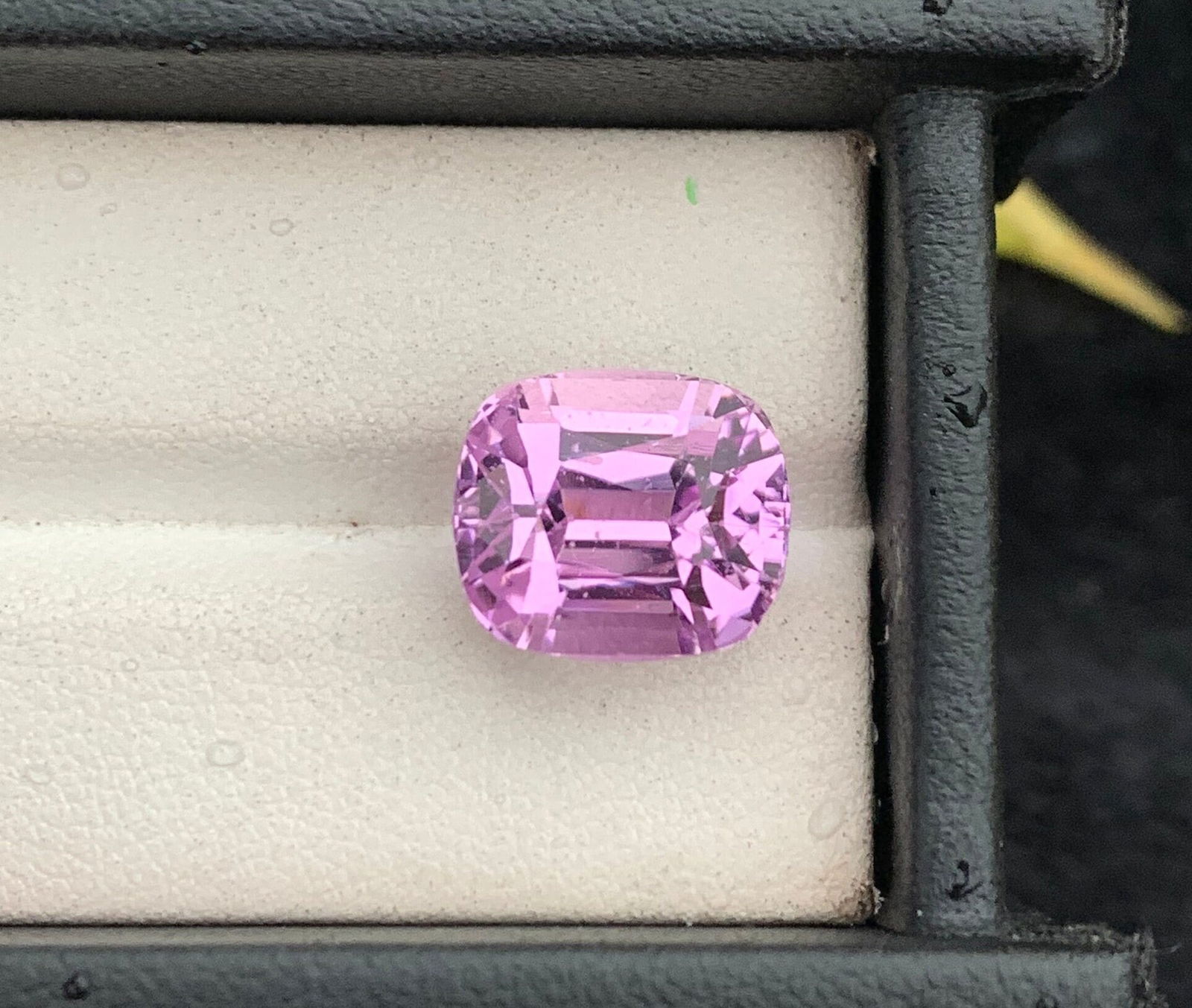 Pink Kunzite Gemstone: 12.30 Carat Cushion Cut, Afghanistan Origin: Materials: Gemstone: Kunzite Carat weight: 12.30 This resplendent gem showcases a dazzling pink hue and is meticulously fashioned in a cushion shape, meticulously tailored for pendant settings. With a