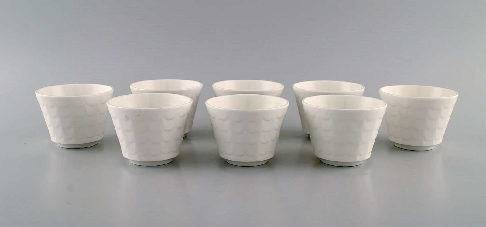 Wilhelm Kåge for Gustavsberg. Eight herb pots in white glazed porcelain. Swedish design, 1960s.: Title: Wilhelm Kåge for Gustavsberg. Eight herb pots in white glazed porcelain. Swedish design, 1960s. Description: Wilhelm Kåge for Gustavsberg. Eight herb pots in white glazed porcelain.