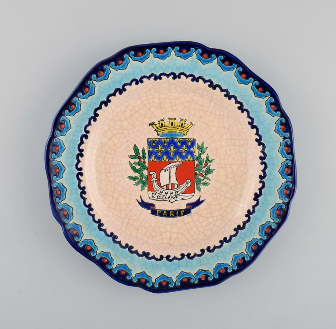Longwy, France. Art deco plate in glazed stoneware with hand-painted Parisian coat of arms and: Title: Longwy, France. Art deco plate in glazed stoneware with hand-painted Parisian coat of arms and foliage. 1920s / 30s. Description: Longwy, France. Art deco plate in glazed stoneware with