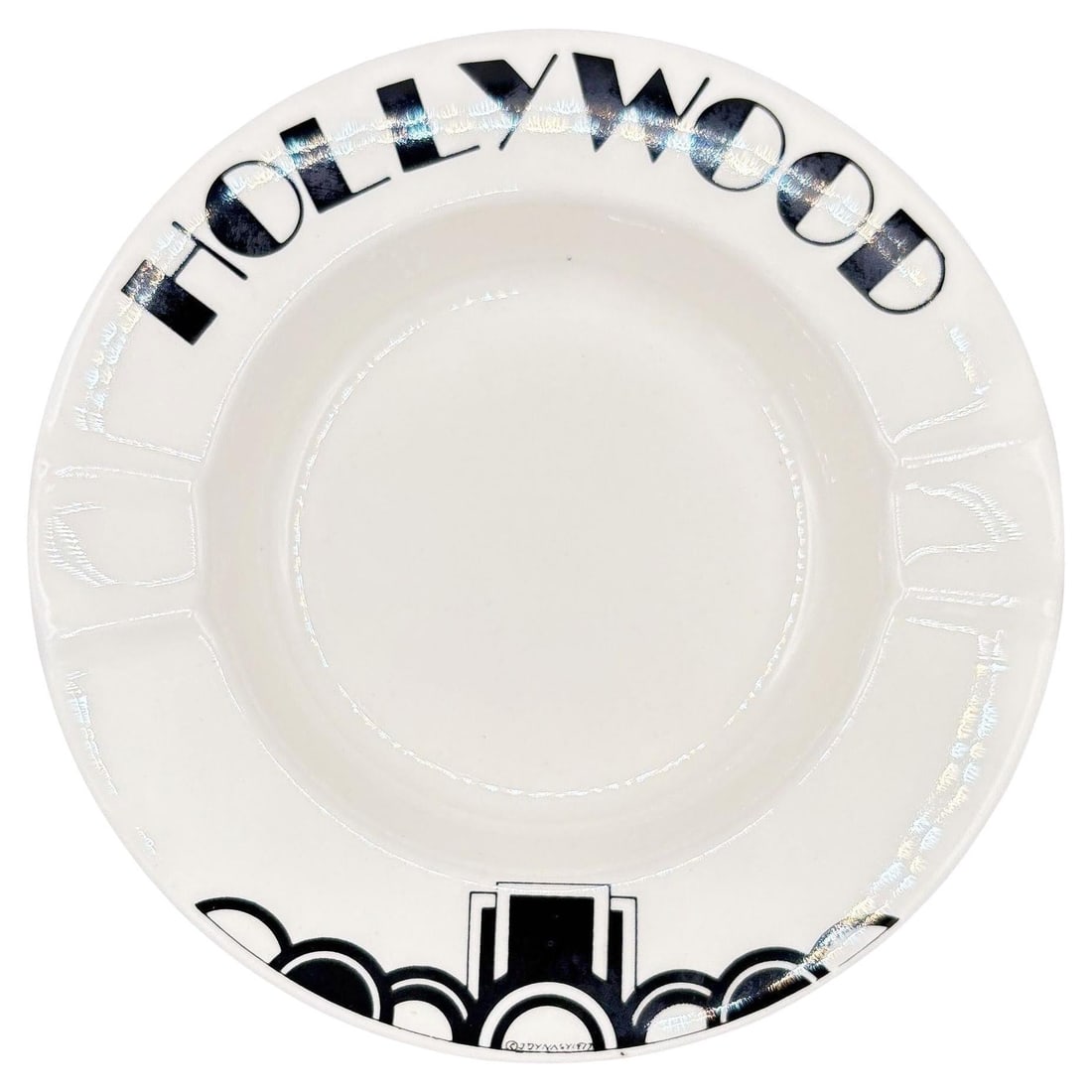 1977 Art Deco Style 8” Porcelain Hollywood Bowl Round Ashtray, Signed: Title: 1977 Art Deco Style 8” Porcelain Hollywood Bowl Round Ashtray, Signed Description: 1977 Art Deco style 8” porcelain Hollywood Bowl round ashtray featuring the word "Hollywood" along
