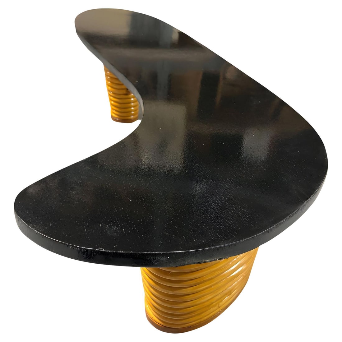 Rare Restored Rattan Amoeba L-Shaped Coffee Table w/ Stacked Legs: Title: Rare Restored Rattan Amoeba L-Shaped Coffee Table w/ Stacked Legs Description: Rare restored rattan L-shaped Amoeba coffee table with glossy black lacquer style top and 2 stacked legs The