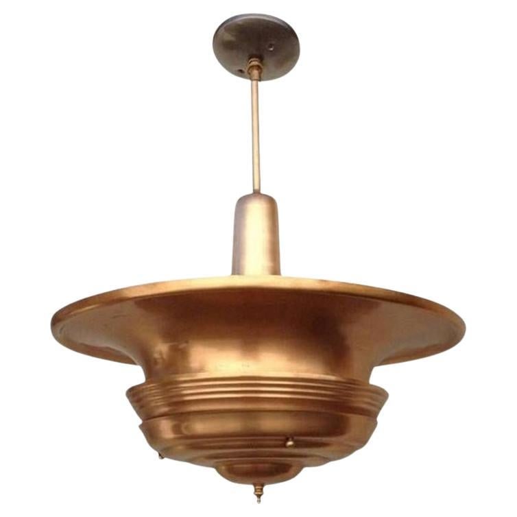 Streamline Machine Age Copper Tiered Disk Saucer Ceiling Hanging Pendant: Title: Streamline Machine Age Copper Tiered Disk Saucer Ceiling Hanging Pendant Description: Machine age copper ceiling hanging pendant with a large copper saucer shade connected to a hanging stem