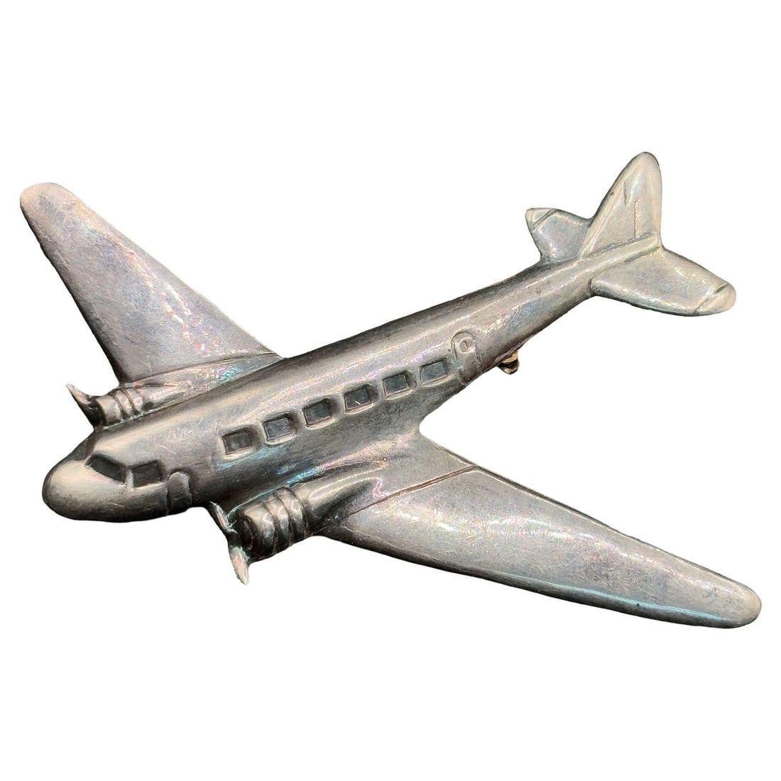 1930s World War II Sterling Silver DC-3 Airplane Pin: Title: 1930s World War II Sterling Silver DC-3 Airplane Pin Description: This large silver DC-3 airplane pin dates to the 1930s through World War II, a period when the DC-3 revolutionized air travel