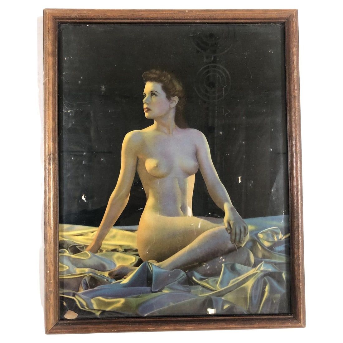 1942 WWII Pin-up Nude Female Lithograph by Signed C Moss in Wood Frame: Title: 1942 WWII Pin-up Nude Female Lithograph by Signed C Moss in Wood Frame Description: Original 1942 lithograph artwork print of a nude woman, bare-chested in a sea of silk with soft nighttime