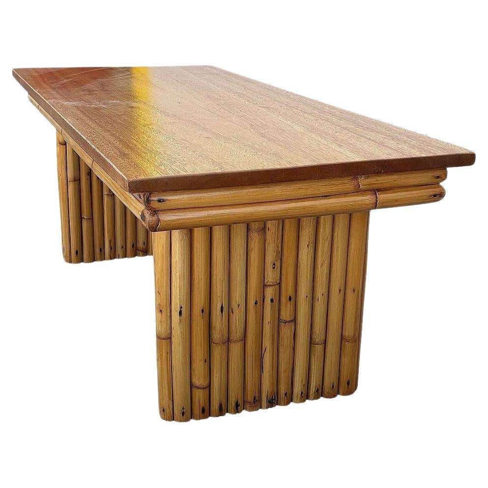 Restored Large 40" Rattan & Mahogany Coffee Table w/ Vertically Stacked Legs: Title: Restored Large 40" Rattan & Mahogany Coffee Table w/ Vertically Stacked Legs Description: This beautifully restored Mid-century rattan and mahogany coffee table showcases a striking design with