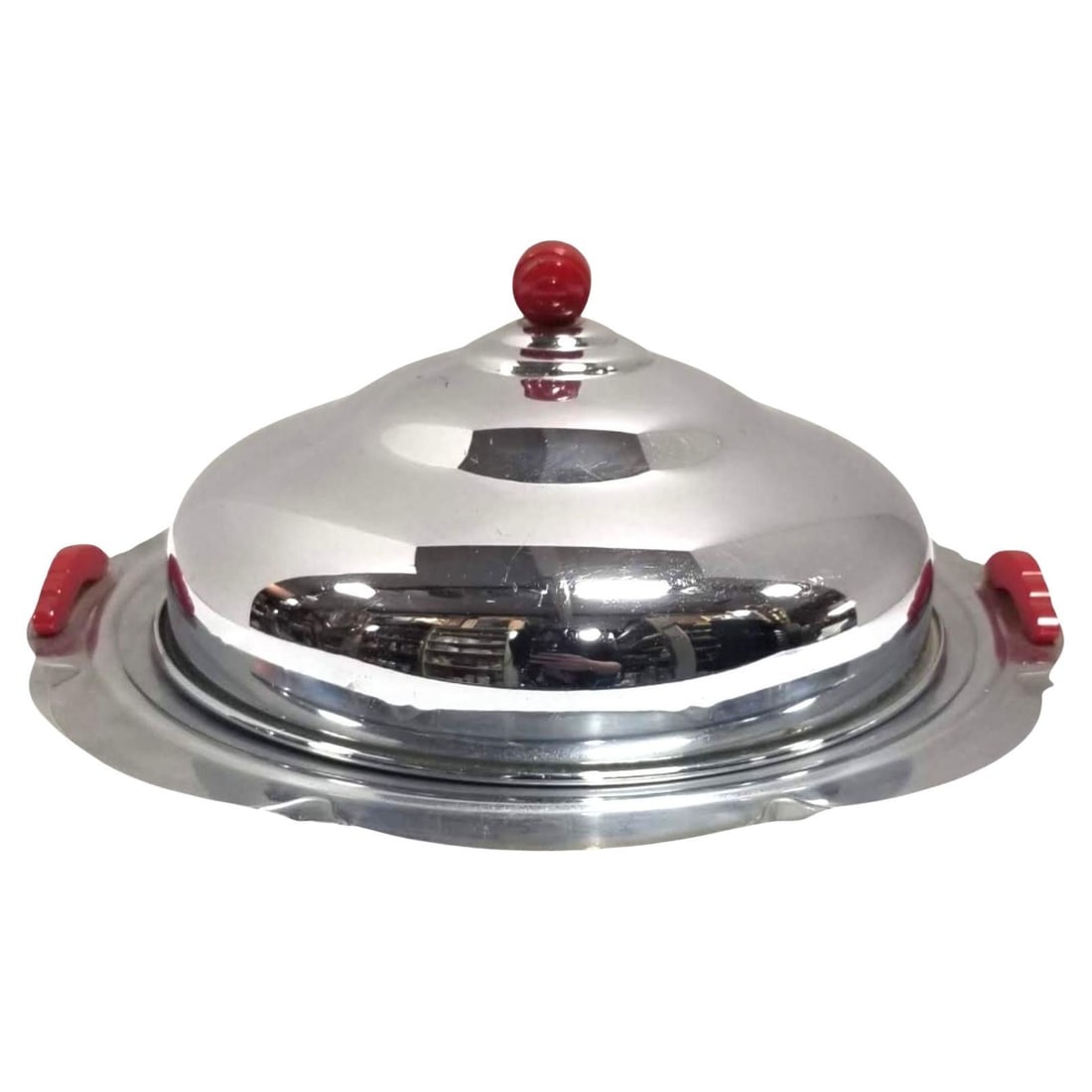 Midcentury Chrome Serving Tray: Title: Midcentury Chrome Serving Tray Description: Midcentury era chromed steel serving tray with red handles and lid top This midcentury serving tray exudes elegance and sophistication. The gleaming