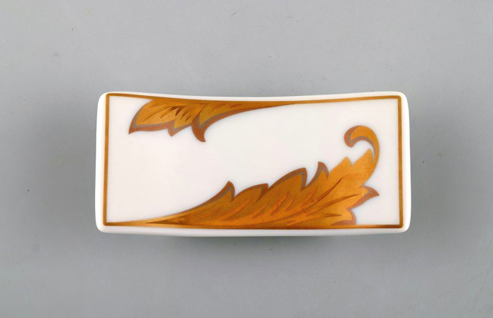 Gianni Versace for Rosenthal. "Arabesque Gold" porcelain knife rest with gold decoration. Late 20th (1 of 5)