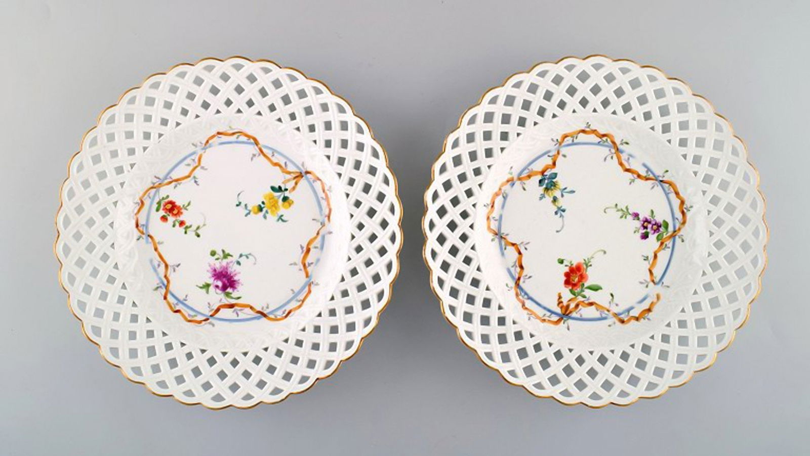 Two antique Meissen plates in pierced porcelain with hand-painted floral motifs. Museum Quality. (1 of 6)