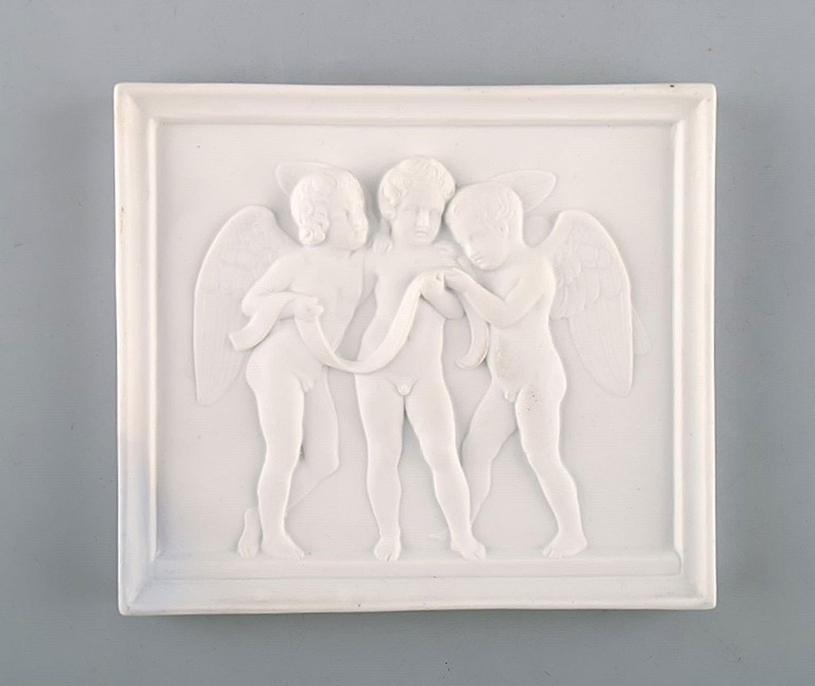 Royal Copenhagen after Thorvaldsen. Antique rare biscuit plaque. Three angel boys. 1870's.: Title: Royal Copenhagen after Thorvaldsen. Antique rare biscuit plaque. Three angel boys. 1870's. Description: Royal Copenhagen after Thorvaldsen. Antique rare biscuit plaque. Three angel boys.