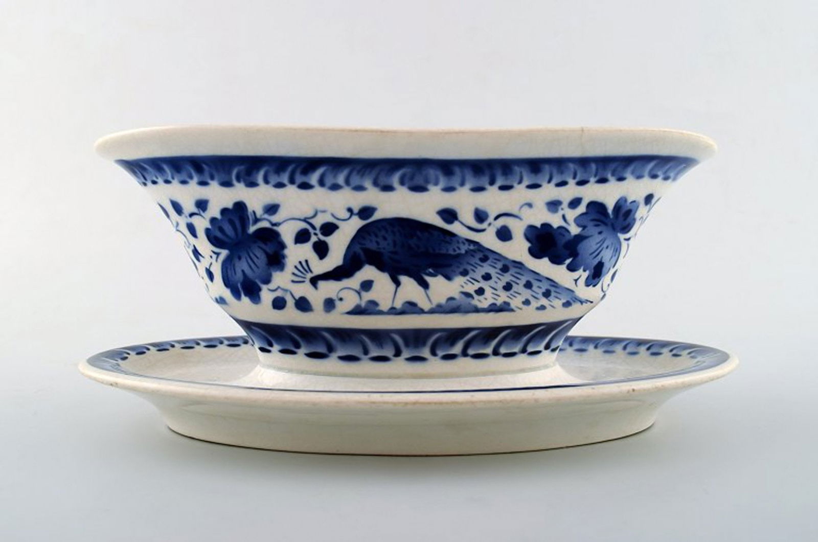 Peacock from Copenhagen's faience factory / Aluminia. Sauceboat in faience.: Title: Peacock from Copenhagen's faience factory / Aluminia. Sauceboat in faience. Description: Peacock from Copenhagen's faience factory / Aluminia. Sauceboat in faience. We have many pieces on