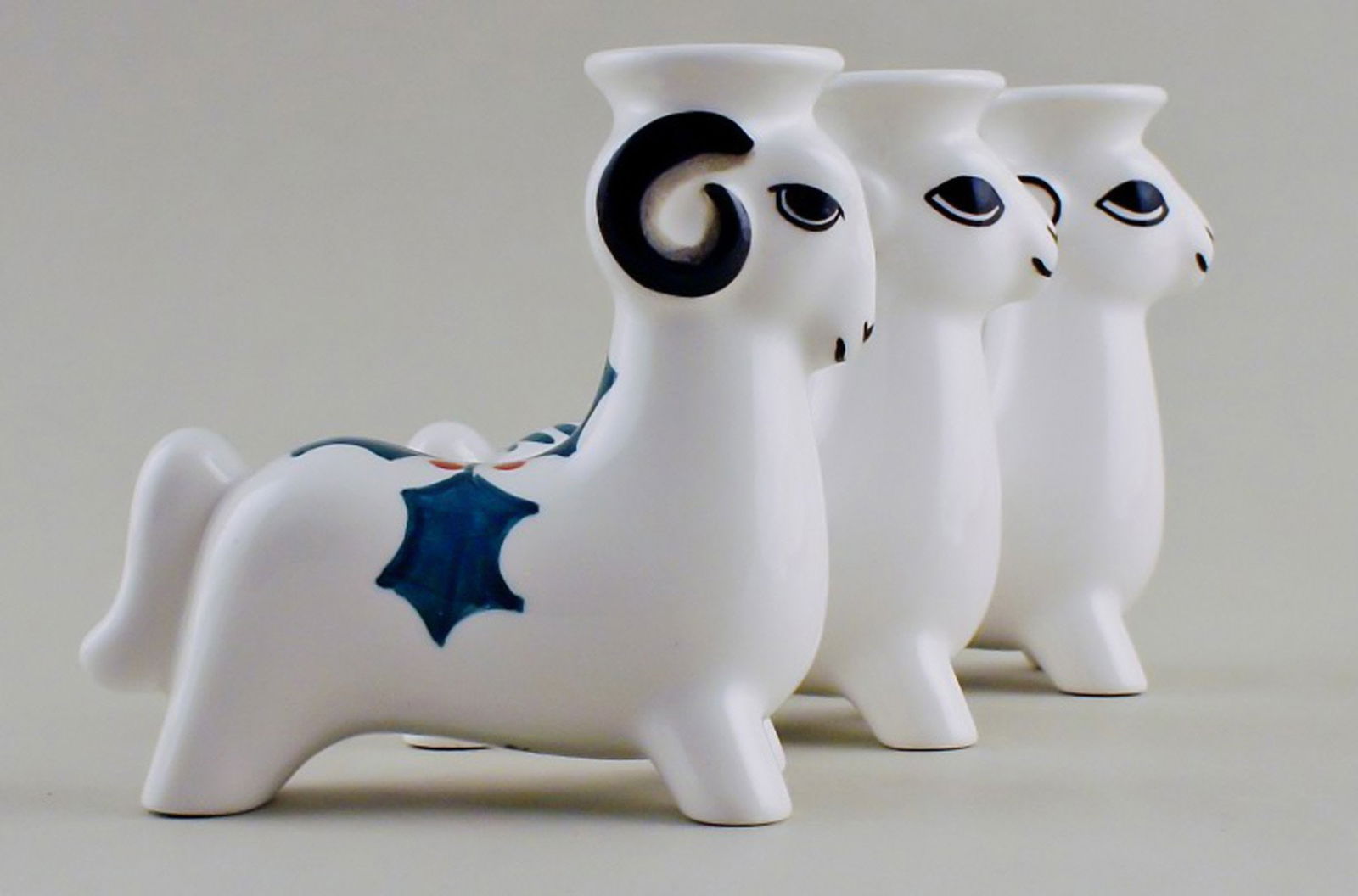 Royal Copenhagen faience candlesticks, Christmas bucks. 3 pcs. in stock.: Title: Royal Copenhagen faience candlesticks, Christmas bucks. 3 pcs. in stock. Description: 3 Royal Copenhagen faience candlesticks, Christmas bucks. In perfect condition. Measures 10 x 10 cm.