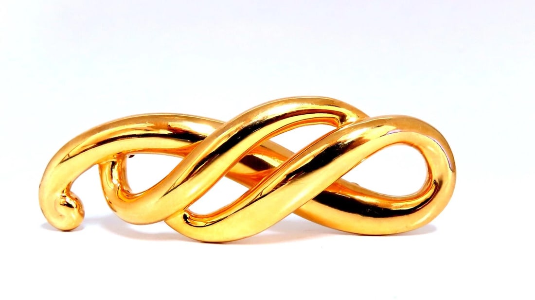 Curling Iconic Pin 14kt**: Title: Curling Iconic Pin 14kt** Description: MAGNIFICENT JEWELS Iconic Curling Deco pin. 62 x 22mm 14kt. yellow gold 8.3 grams All Items come with a Free White ribbon gift box. Reserve: