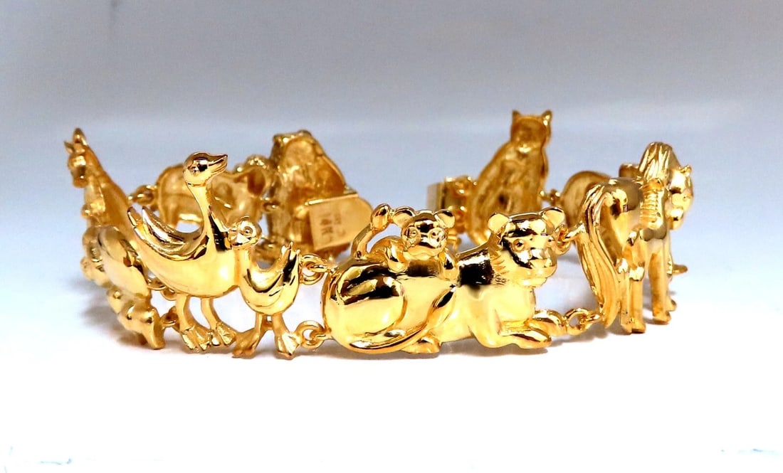 14kt Gold Animal Trail Noah Ark Bracelet Bear Sheep Kangaroo Pig Swan Lion**: Title: 14kt Gold Animal Trail Noah Ark Bracelet Bear Sheep Kangaroo Pig Swan Lion** Description: 9 charm link bracelet. Bear Sheep Kangaroo Pig Swan Lion Pony Puppy Cat 15mm Diameter 14 karat yellow