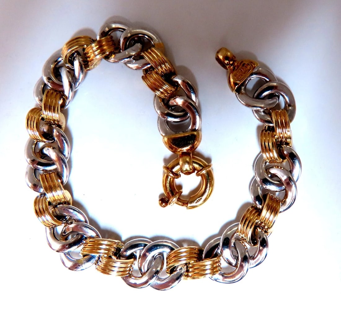 Two Toned Chain Link Loop Bracelet 14kt gold**: Title: Two Toned Chain Link Loop Bracelet 14kt gold** Description: Looping Chain Link Bracelet Durable, Well Made 14kt. yellow / White gold 15 Grams. 7.5 inch long 10mm wide All Items come with a