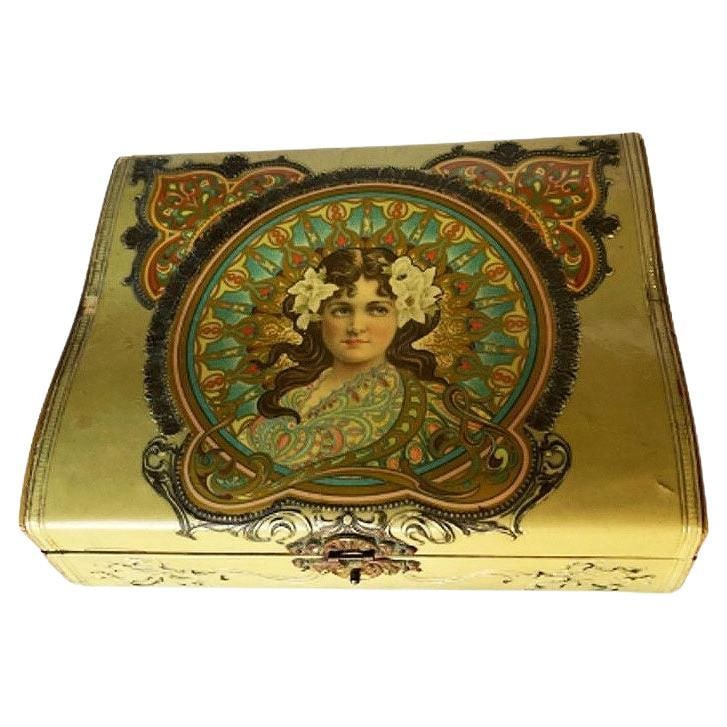 Art Nouveau Satin Lined Jewelry Box with/ Portrait on Cover: Title: Art Nouveau Satin Lined Jewelry Box with/ Portrait on Cover Description: Art Nouveau Jewelry Pink Satin Lined Box, the woman is depicted with flowers in her hair and pink cheeks. Box has