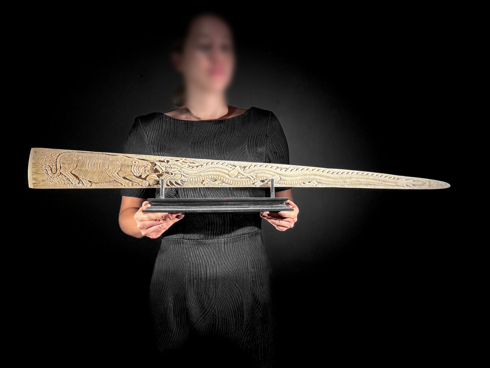 An extra large carved swordfish rostrum - Dragon tiger carving: Title: An extra large carved swordfish rostrum - Dragon tiger carvingMaker:UnknownOrigin: IndonesiaDate/Period:2025Materials:Xiphias Gladius, Bone, woodDimensions:Length: 90 cm / 35.4