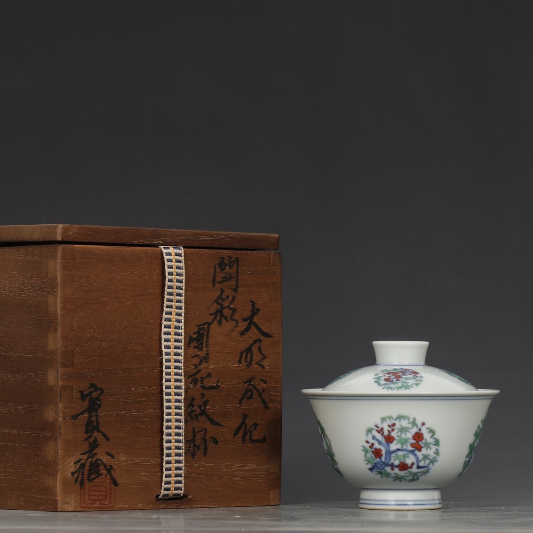 Doucai Porcelain Teabowl w Flower Design,Box: Title: Doucai Porcelain Teabowl w Flower Design,Box Origin: Chinese Date/Period: After1910 Materials: Porcelain Dimensions: 80x97(mm) 3.15x3.82(inches) Reserve: $499.00 Shipping:Domestic: Shipping