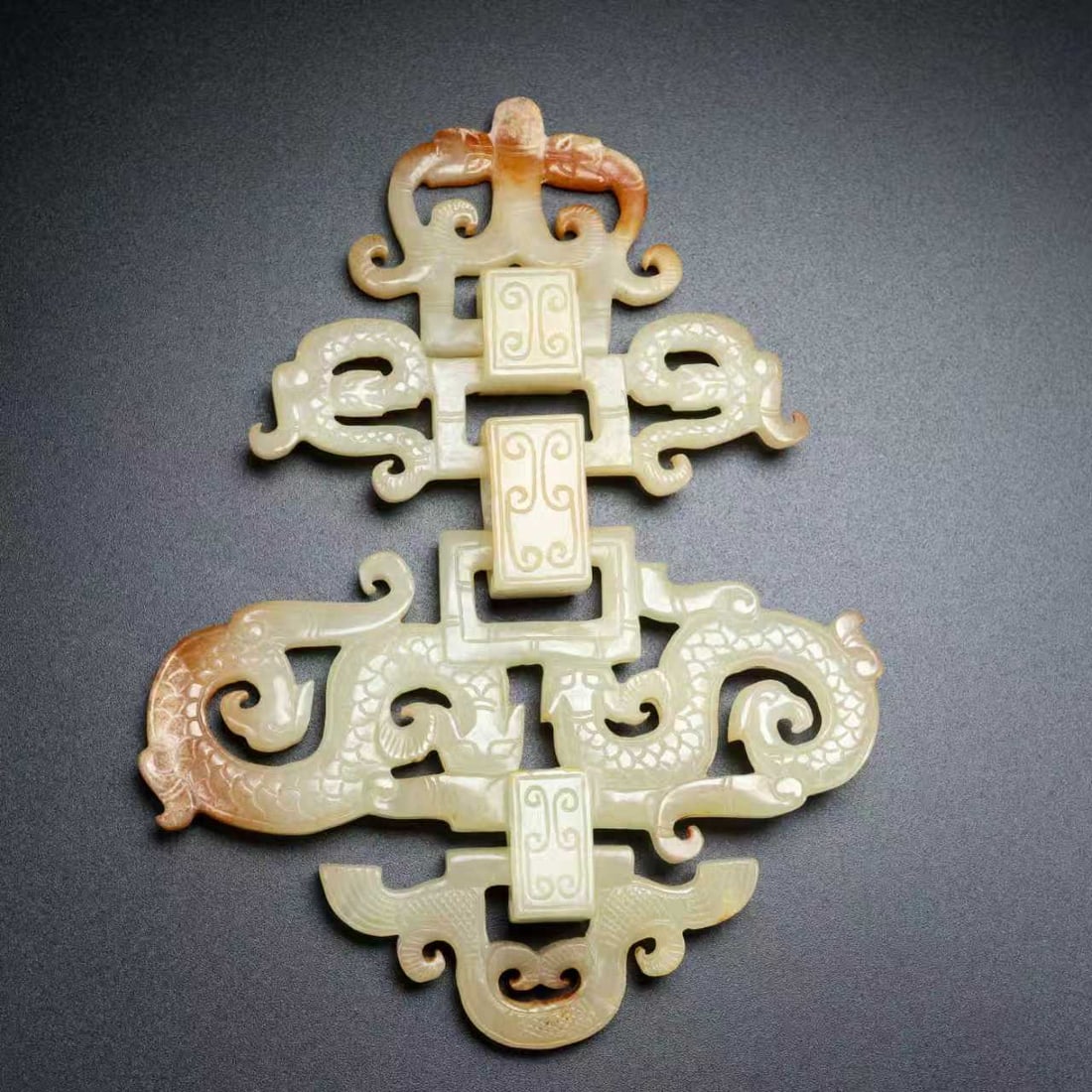 Openwork Hetian Jade Dragon Bi Statue: Title: Openwork Hetian Jade Dragon Bi Statue Origin: Chinese Date/Period: After1900 Materials: Hetian Jade Dimensions: 120x90x14(mm) 4.72x3.54x0.55(inches) Weight 0.14 lbs/65g Reserve: $558.00 Shippin