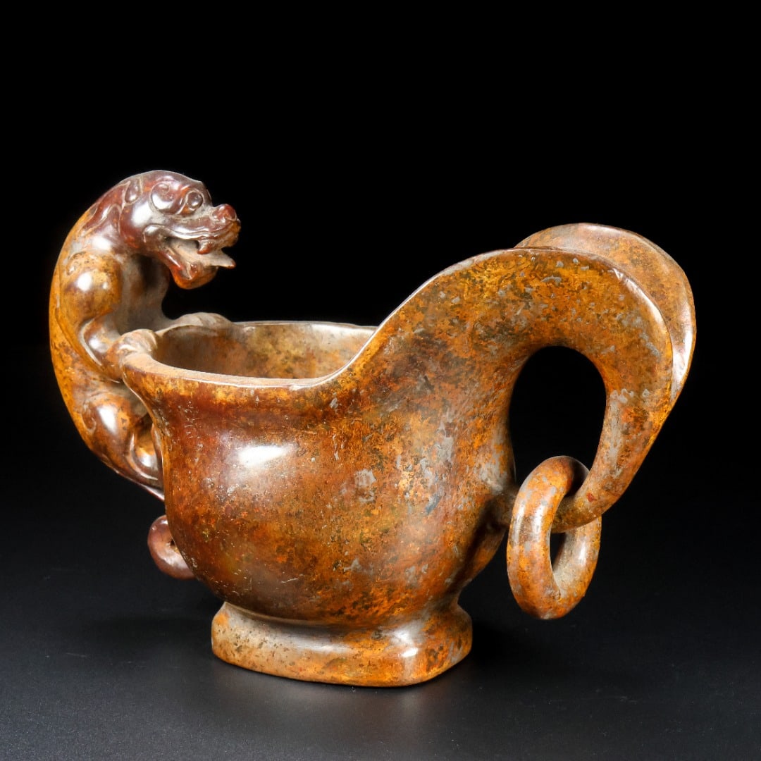 Hetian Jade Wine Cup - Dragon: Title: Hetian Jade Wine Cup - Dragon Origin: Chinese Date/Period: After1890 Materials: Hetian Jade Dimensions: 147x212x93(mm) 5.78x8.35x3.66(inches) Weight 2.36 lbs/1072g Reserve: $1,999.00 Shipping: