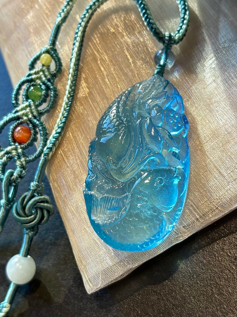 Natural Aquamarine Pendant - Double Fish,Lotus: Title: Natural Aquamarine Pendant - Double Fish,Lotus Origin: Chinese Date/Period: After2025 Materials: Aquamarine Dimensions: 47x26x13(mm) 1.85x1.02x0.51(inches) Weight 0.05 lbs/24g Reserve: $399.00