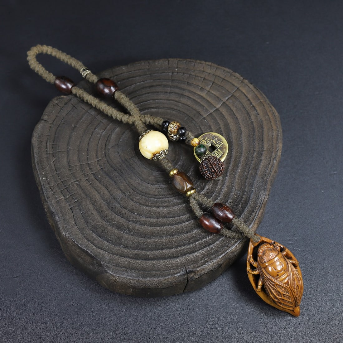 Olive Nut Hand-Carved Cicada Pendant: Title: Olive Nut Hand-Carved Cicada Pendant Origin: Chinese Date/Period: After1900 Materials: Olive Nut Dimensions: 70x35(mm) 2.76x1.38(inches) Reserve: $99.00 Shipping: Domestic: Shipping rates are