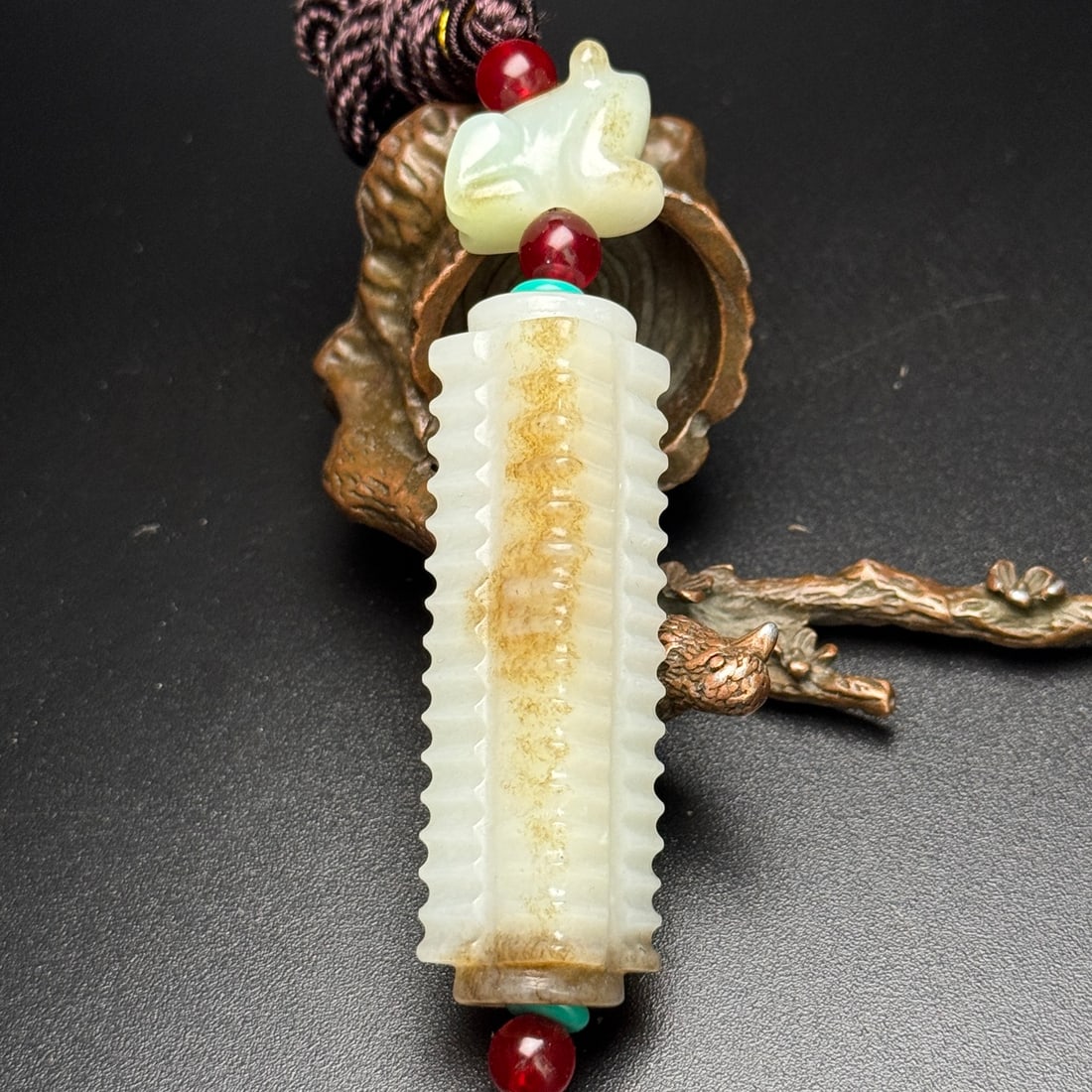 Hetian Jade Pendant - Cong: Title: Hetian Jade Pendant - Cong Origin: Chinese Date/Period: After1900 Materials: Hetian Jade Dimensions: 20x16x12(mm) 0.79x0.63x0.47(inches) 17x18x65(mm) 0.67x0.71x2.56(inches) Weight 0.12 lbs/54g