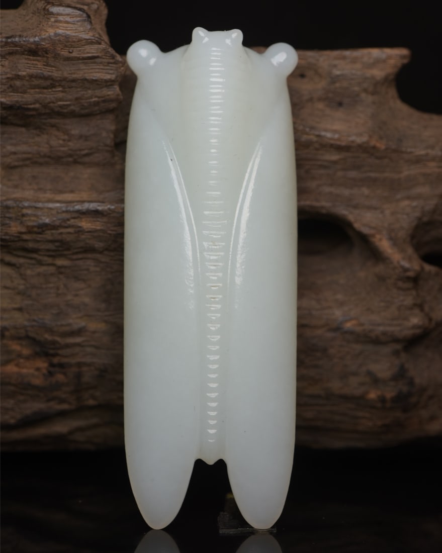 Hetian Jade Pendant - Cicada: Title: Hetian Jade Pendant - Cicada Origin: Chinese Date/Period: After2000 Materials: Hetian Jade Dimensions: 83x30x18(mm) 3.27x1.18x0.71(inches) Weight 0.13 lbs/61g Reserve: $388.00 