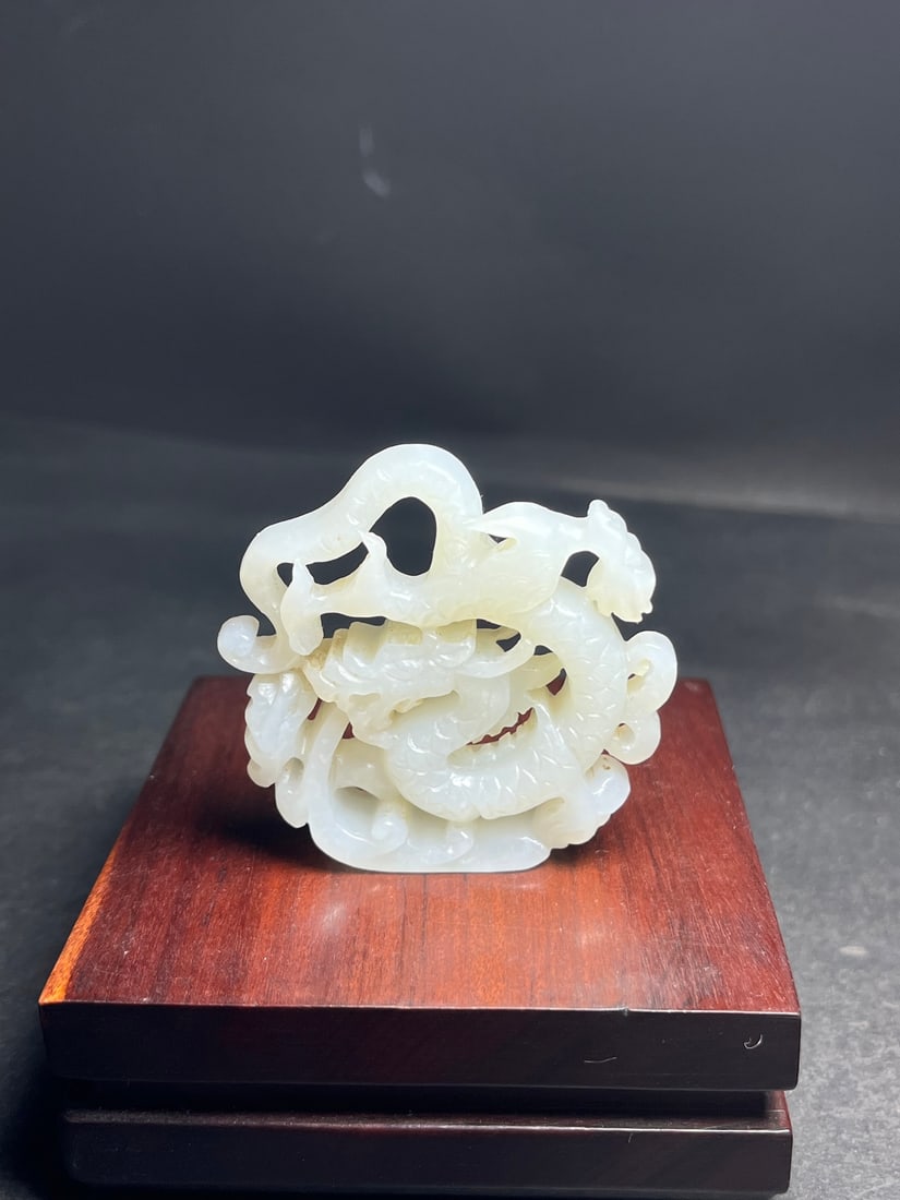 Hetian Jade Pendant - Dragon: Title: Hetian Jade Pendant - Dragon Origin: Chinese Date/Period: After2000 Materials: Hetian Jade Dimensions: 52x11x50(mm) 2.05x0.43x1.97(inches) Weight 0.08 lbs/36g Reserve: $499.00 