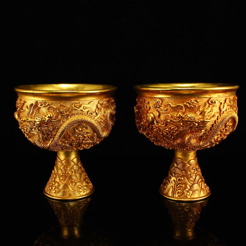 A Pair Gilt Gold Bronze Low Relief Dragon Design Cup: Title: A Pair Gilt Gold Bronze Low Relief Dragon Design Cup Origin: Chinese Date/Period: After1890 Materials: Gilt Gold Bronze Dimensions: 110x110x115(mm) 4.33x4.33x4.52(inches) Weight 3.24 lbs/1468g