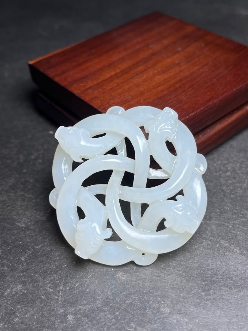 Openwork Hetian Jade Pendant - Dragon: Title: Openwork Hetian Jade Pendant - Dragon Origin: Chinese Date/Period: After2000 Materials: Hetian Jade Dimensions: 54x54x12(mm) 2.13x2.13x0.47(inches) Weight 0.07 lbs/34g Reserve: $399.00 