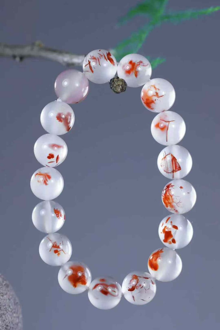 11.5mm Nanhong Agate Beads Bracelet: Title: 11.5mm Nanhong Agate Beads Bracelet Origin: Chinese Date/Period: After2025 Materials: Nanhong Agate Dimensions: 11.5(mm) 0.45(inches) Weight 0.08 lbs/34.2g Reserve: $1,799.00 