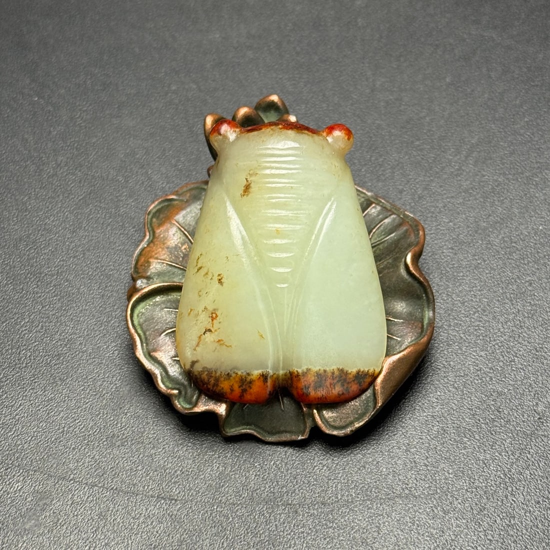 Hetian Jade Pendant - Cicada: Title: Hetian Jade Pendant - Cicada Origin: Chinese Date/Period: After2000 Materials: Hetian Jade Dimensions: 43x31x10(mm) 1.69x1.22x0.39(inches) Weight 0.04 lbs/19g Reserve: $150.00 Shipping: Domes