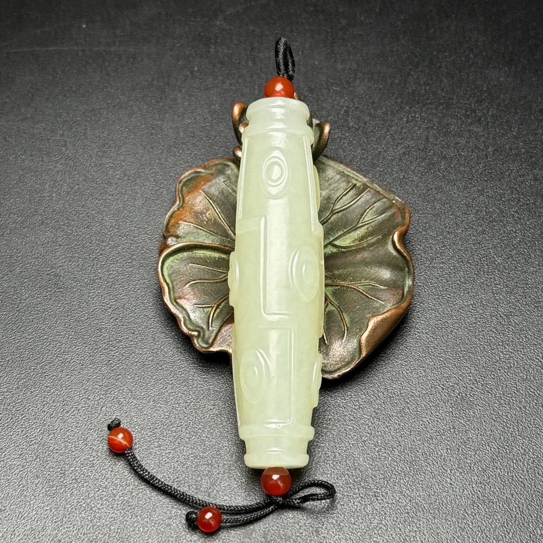 Hetian Jade Pendant,Nine Eye: Title: Hetian Jade Pendant,Nine Eye Origin: Chinese Date/Period: After2000 Materials: Hetian Jade Dimensions: 17x66(mm) 0.67x2.60(inches) Weight 0.06 lbs/29g Reserve: $285.00 Shipping: Domestic: Ship