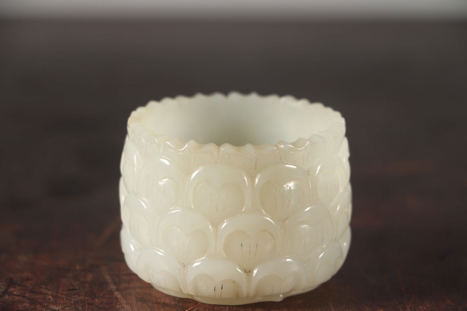 Hetian Jade Hand-Carved Lotus Cup,Old: Title: Hetian Jade Hand-Carved Lotus Cup,Old Origin: Chinese Date/Period: After1800 Materials: Hetian Jade Dimensions: 55x40(mm) 2.17x1.57(inches) Weight 0.22 lbs/99g Reserve: $1,999.00 