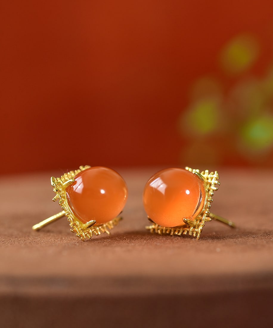 A Pair Silver Inlay Nanhong Agate Earrings: Title: A Pair Silver Inlay Nanhong Agate Earrings Origin: Chinese Date/Period: After2020 Materials: Silver,Nanhong Agate Dimensions: 10.3x8.9(mm) 0.41x0.35(inches) Weight 0.007 lbs/3.01g Reserve: